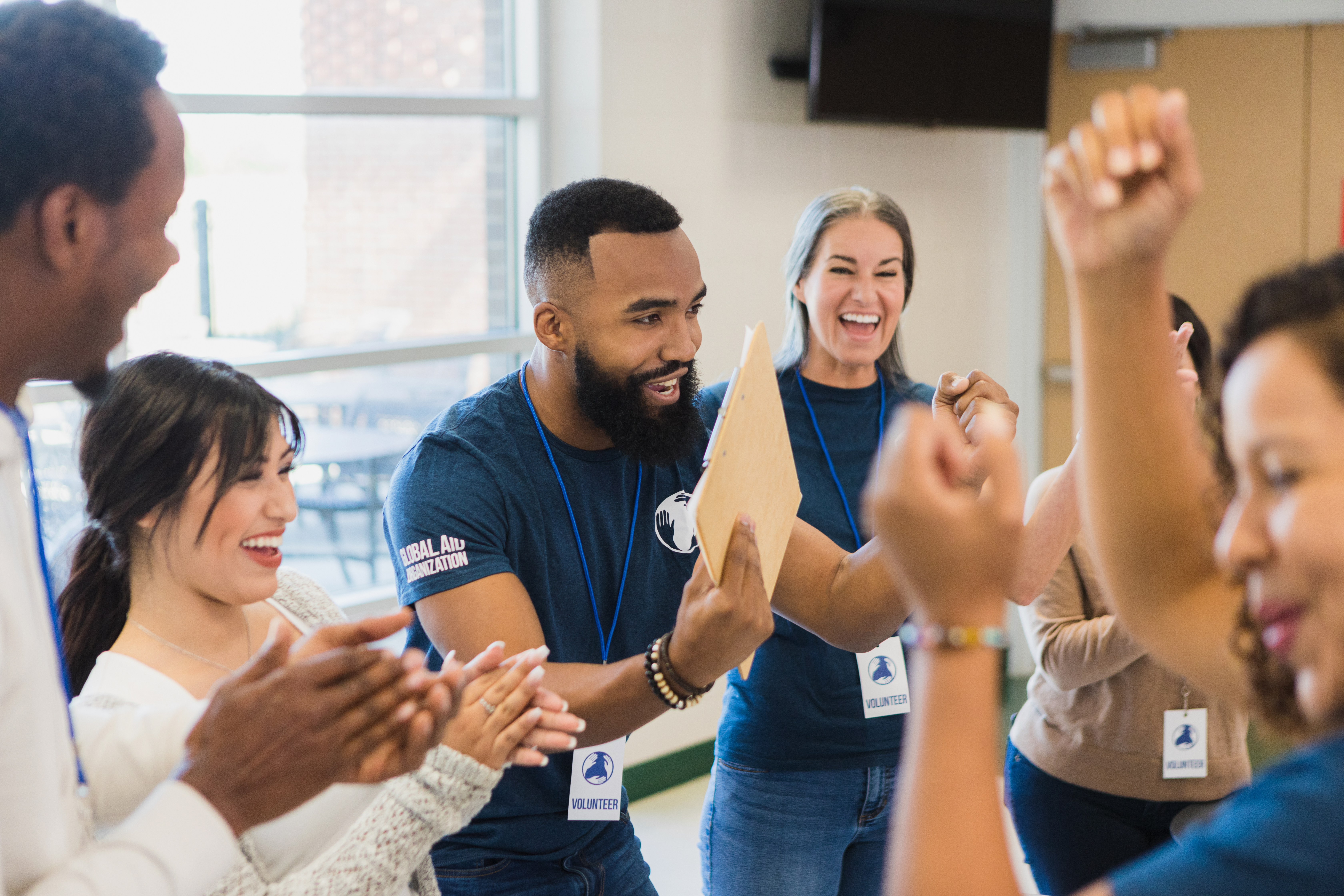 Cheering colleagues volunteering together