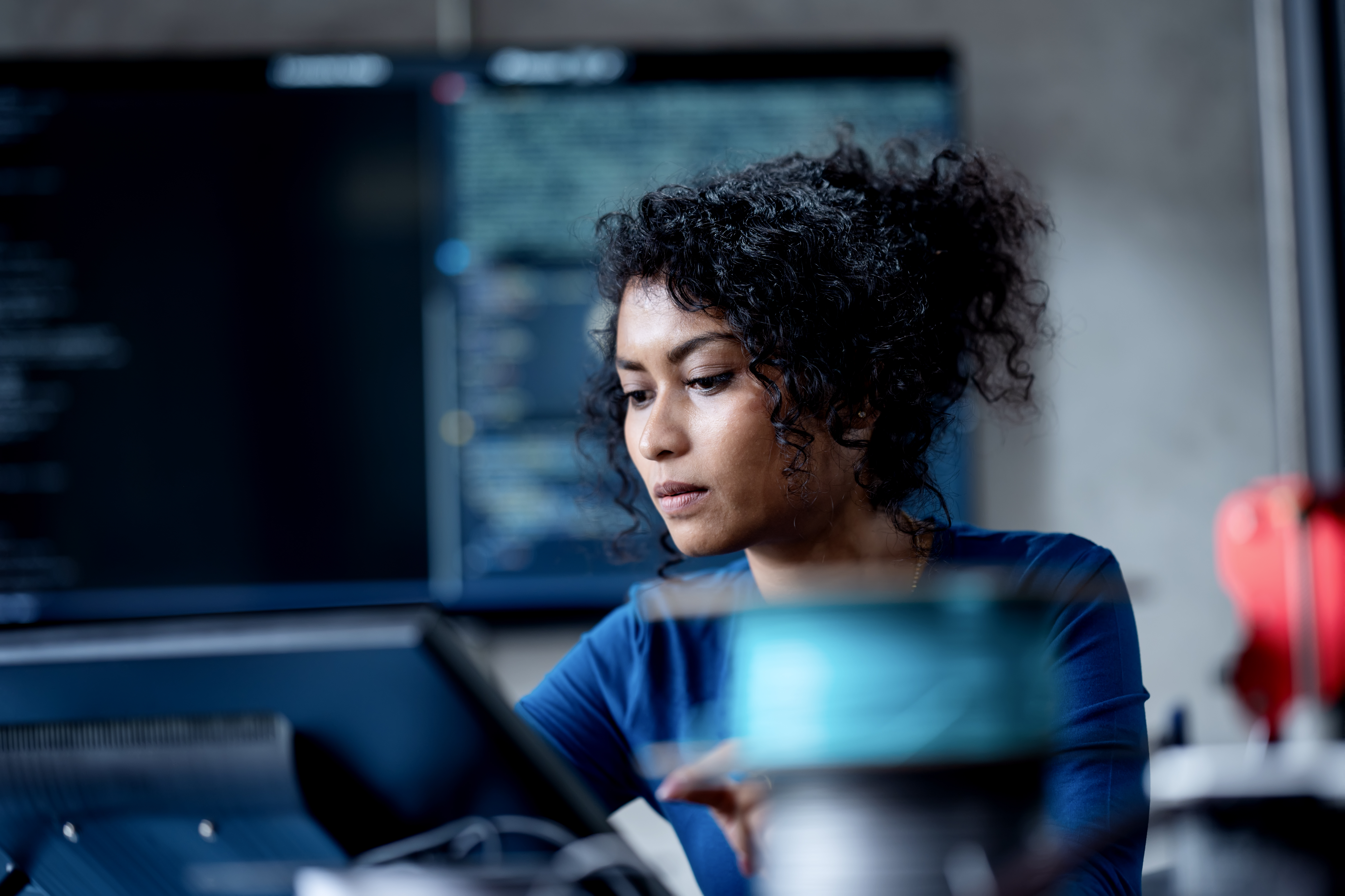 Software engineer focused on her computer screen